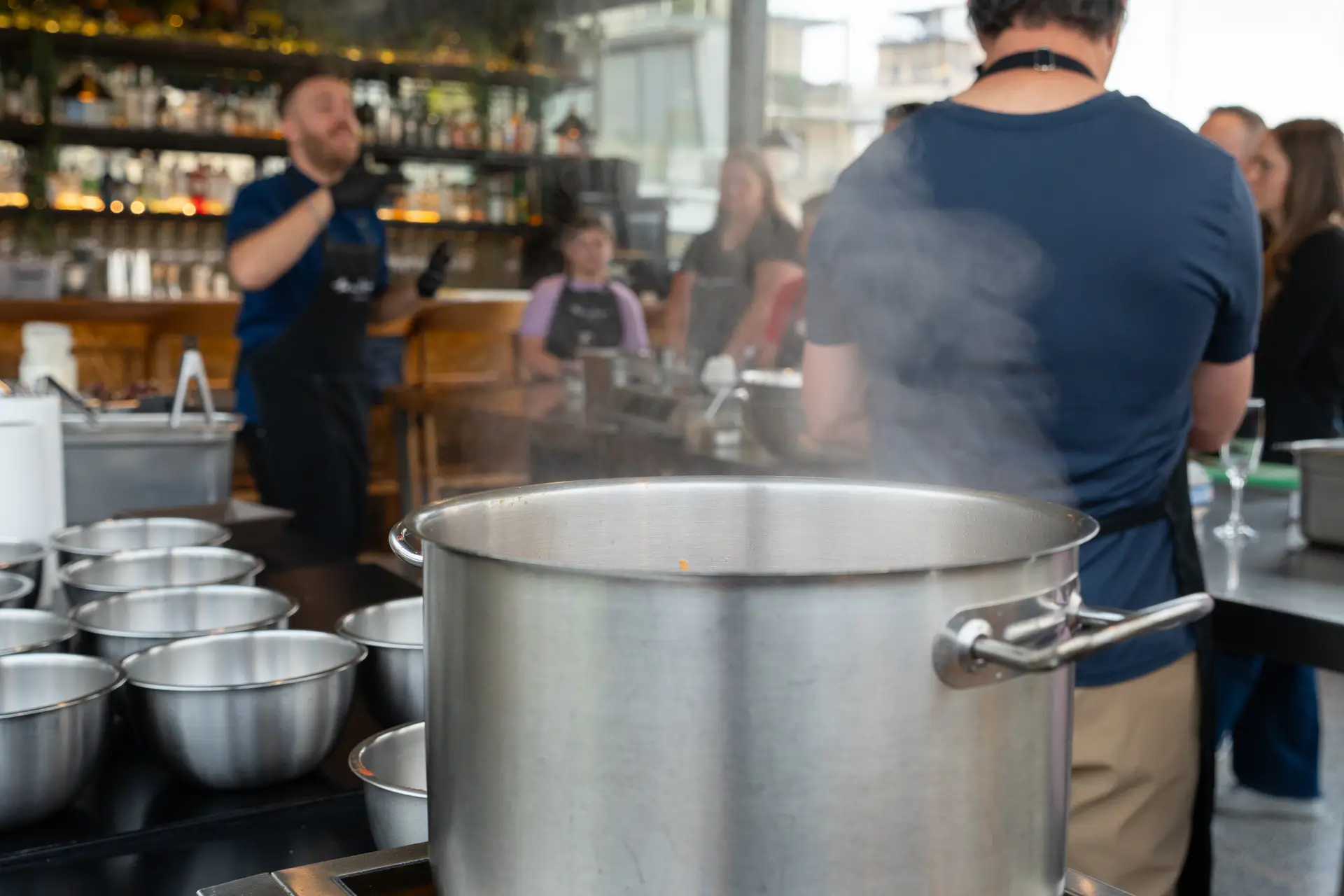 Steam rising from the pot — kitchen energy during the cooking session