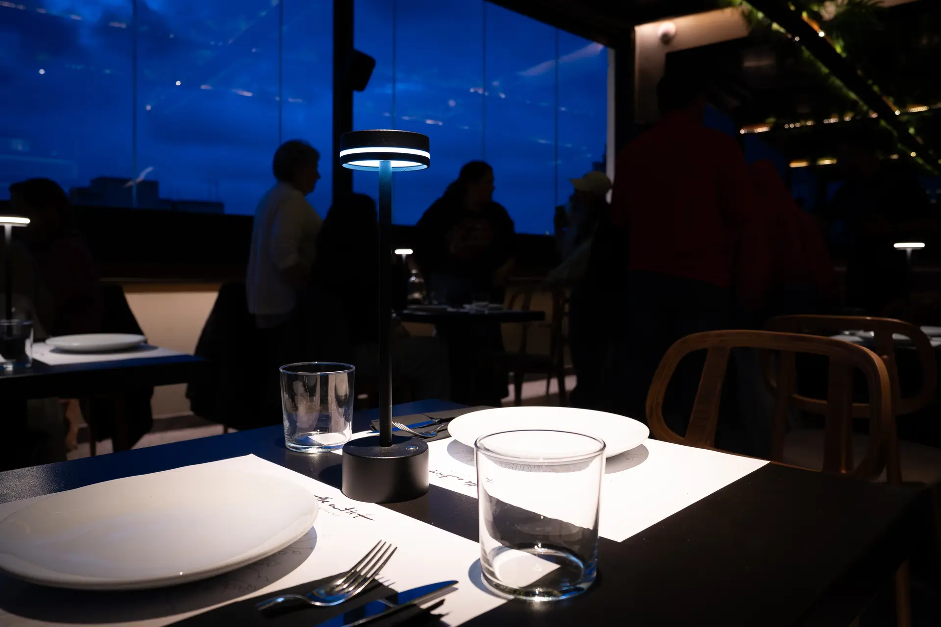 Dinner at The Artist — candlelit rooftop table at dusk, the perfect ending to the class