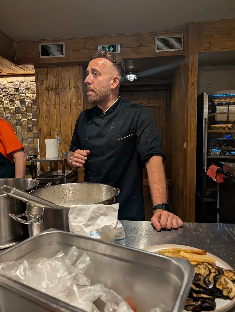 Chef Spyros explaining a technique during the Athens cooking class