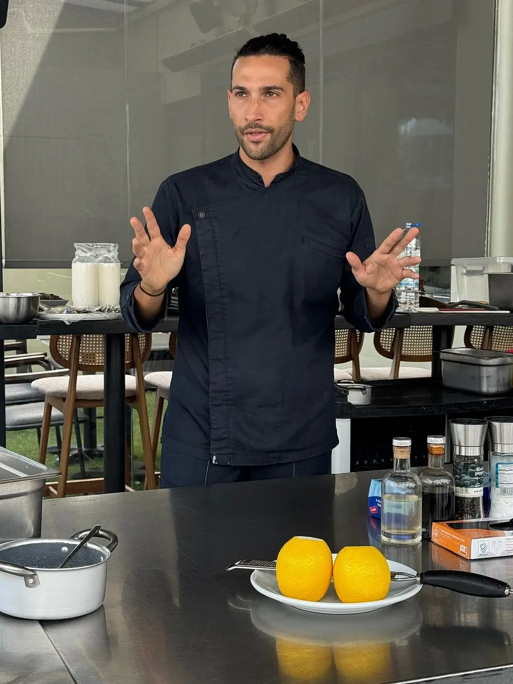 Chef Stamatis presenting ingredients at the start of the cooking class